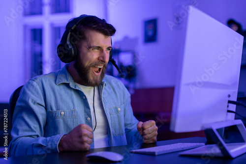 Gamer expressing happiness during a game at home