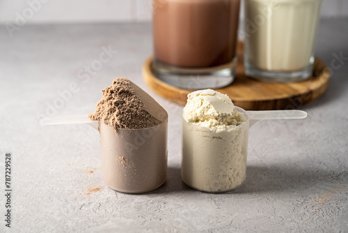 Protein powder and protein drinks, with scoops. Food supplement, bodybuilding, fitness and sport photo