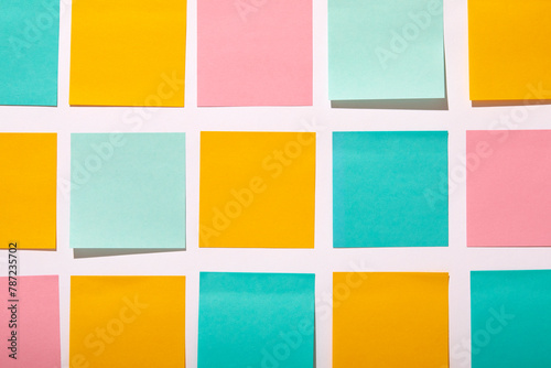 Rows of colorful blank adhesive notes on white background