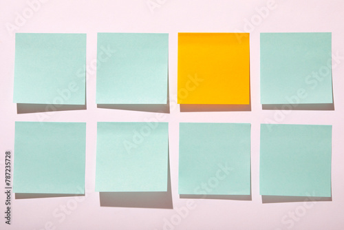 Rows of blank adhesive notes on white background photo