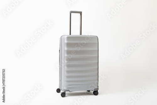 Studio shot of silver rolling suitcase photo