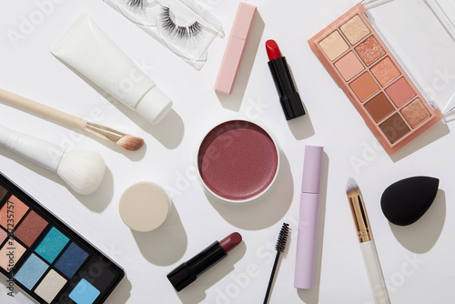 Overhead view of beauty and makeup products on white background photo