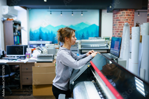 Woman working in printing studio photo
