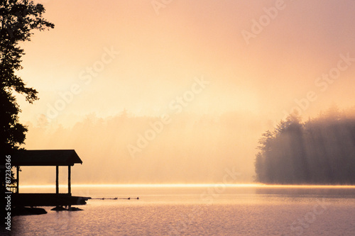 Morning mist above Lake Placid at sunrise in Adirondack Mountains photo