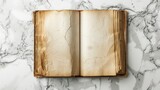 Old opened book with blank pages on white marble background. Top view. Mockup old book