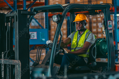 A man in a yellow safety ve...