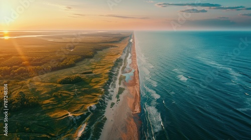 Curonian Spit wth Baltic sea coastline on sunset. Kurshskaya kosa national park near Zelenogradsk. Kaliningrad region. Aerial view  photo