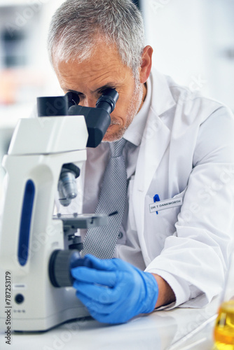 Sample, mature man and microscope in lab for discovery, medical research and test for forensics. Male person, analyze and doctor for biology or pathology exam, lens and check results of experiment