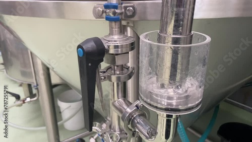 Manometer equipment for pressure control at microbrewery. Gauges pressure control device: manometer at craft brewery. Water gurgles and water bubbles. photo