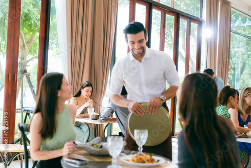 Engaging Service at the Eatery, Clients Enjoying Conversations while Waitstaff Attend, Cafe Scene Filled with Delicious Food and Beverages, Where Lifestyle Meets Business in Comfortable Dining photo