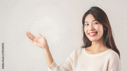 Asian woman open hand to copy space and looking at camera with smile face and happy Pretty girl act like a satisfied product use for advertising with isolated on white backgroundinclu : Generative AI