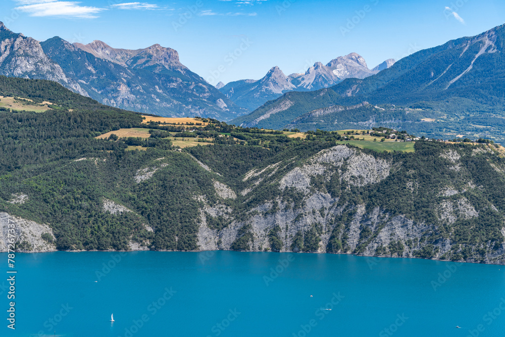 Lake of Serre-Poncon during summer, surrounded by beautiful alpine landscape, France Lake of Serre-Poncon during summer, surrounded by beautiful alpine landscape, France