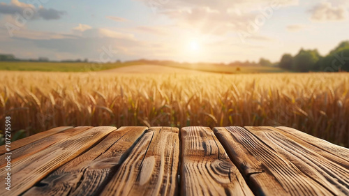 empty wooden tabletop with blurred wheat field background for product display montage