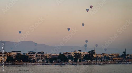 sunrise view from the Nile of hot air balloons over Luxor , Egypt
