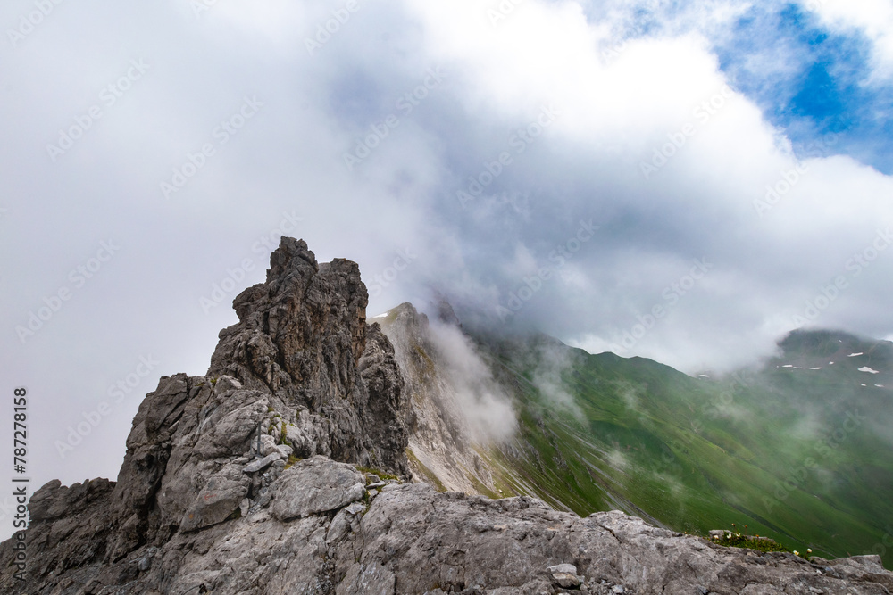 Clouds Over the Rugged Cliffs and Steep Slopes of Gamsluggen by Lünersee