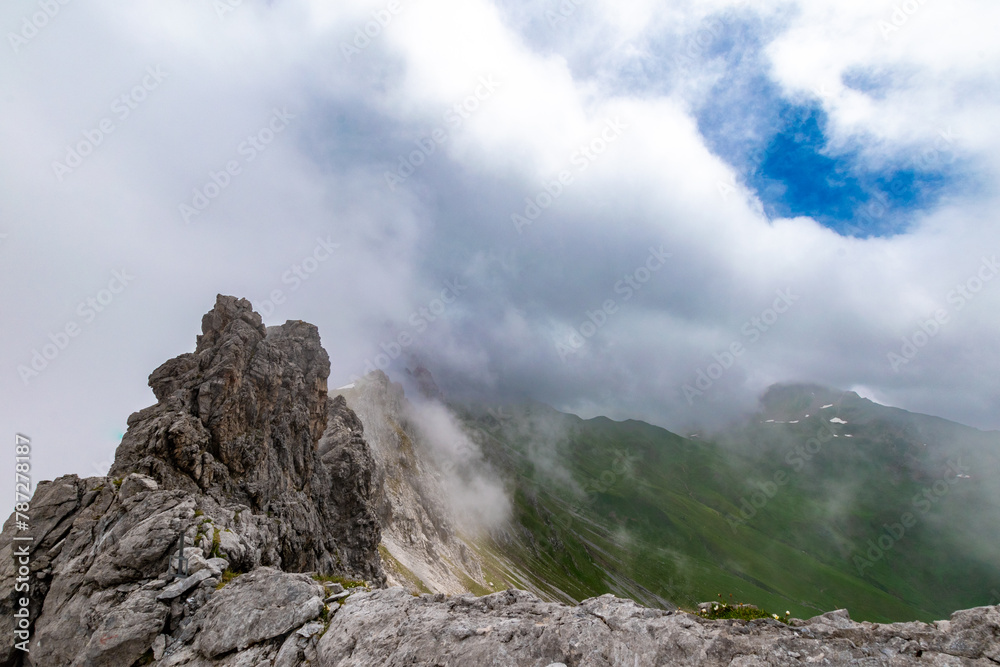 Clouds Over the Rugged Cliffs and Steep Slopes of Gamsluggen by Lünersee