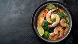 Laksa Shrimp bowl glass noodle dish top view copy space Asian Malaysian food with shrimps bok choy lime ginger and chili Most variations of laksa are prepared with spicy coconut soup : Generative AI