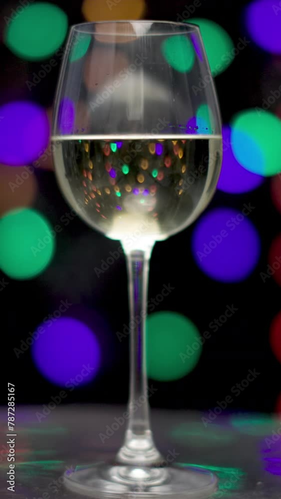 red wine in disco lights in vertical video red wine in disco lights in vertical video