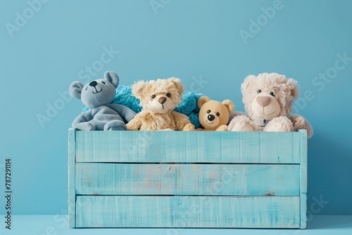Toy box with teddy bear and wooden educational toys for small children, front view