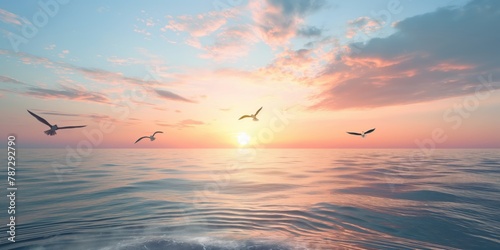 A serene scene capturing the golden hour of sunrise with seagulls flying above a calm sea reflecting the sky's hues © gunzexx png and bg
