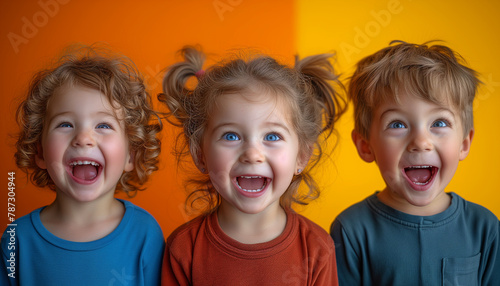 Collage made of three happy portraits of surprised children with opened mouths on colorful background. Concept of hally childhoom. International children's day