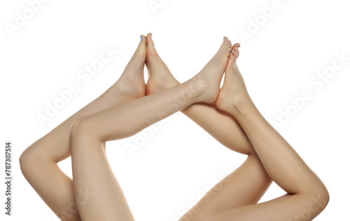 Two pairs od a beautiful well-groomed women's legs close-up on a white isolated background, The concept of epilation of foot skin care