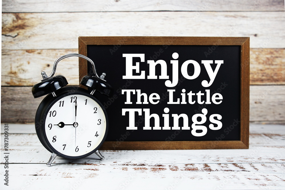 Inspirational quote Enjoy the Little Things text message written on chalkboard background Inspirational quote Enjoy the Little Things text message written on chalkboard background