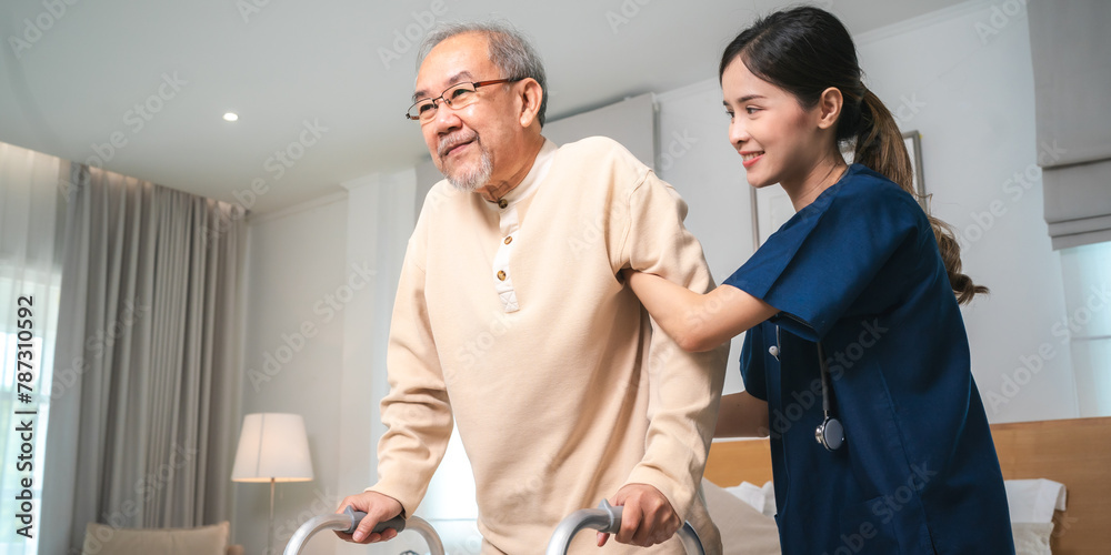 Obraz premium Asian physiotherapist nursing home to support old senior man patient therapy by walker, caregiver nurse help recovery health care with elderly retirement man person at home, health insurance concept