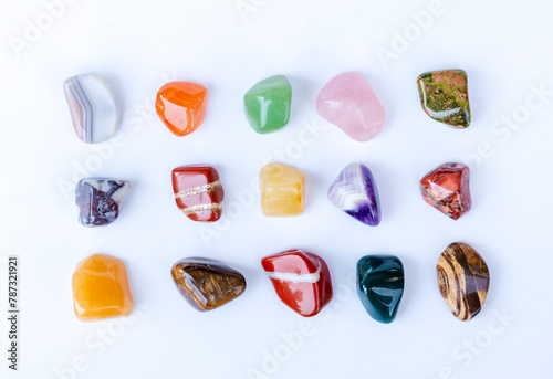 Semi-precious multi-colored stones, minerals on a white background close-up. Mineralogy. Collection of minerals.