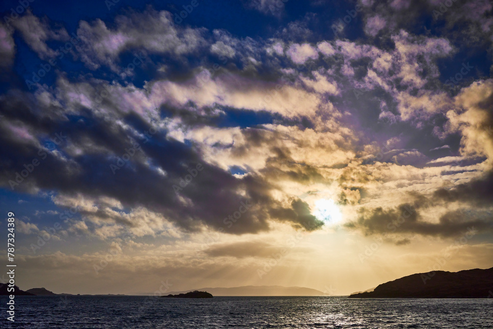 Fototapeta premium West from Craobh Haven, The sun starts to sink low as dusk begins to take shape. Craobh Haven, Argyll and Bute, Scotland