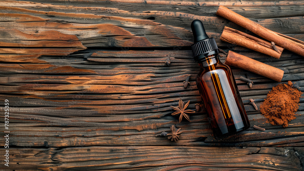 essential oil in a bottle and cinnamon. selective focus.