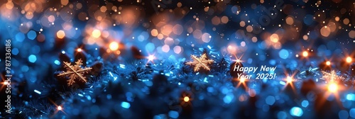 Blue and gold bokeh lights with snowflakes for winter holiday season on dark background