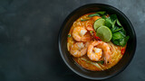 Laksa Shrimp bowl glass noodle dish top view copy space Asian Malaysian food with shrimps bok choy lime ginger and chili Most variations of laksa are prepared with spicy coconut soup : Generative AI