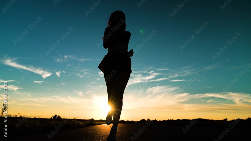 silhouette sports girl running legs along road sunset, joggers park, triathlon competition, sport leisure fitness, healthy running concept, fitness sports woman running up, you can run fast, cardio - obrazy, fototapety, plakaty 