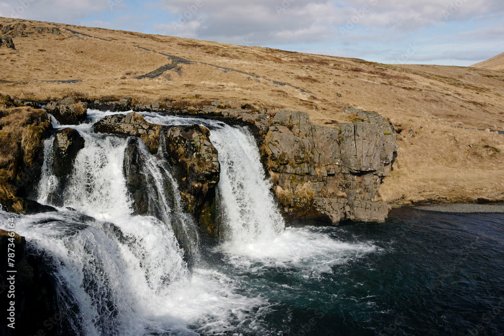 autumn landscape of waterfall at Kirkjufell in Iceland autumn landscape of waterfall at Kirkjufell in Iceland