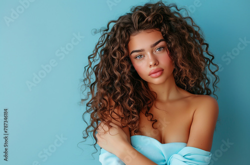 beauty model portrait with a curly hair and arms crossed