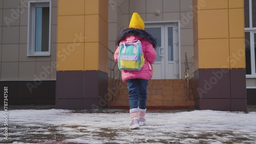 Happy Child Kid girl daughter goes class, person with backpack goes school building white snow winter, girl with backpack walks through snow school yard, Child with backpack Goes class lesson, well