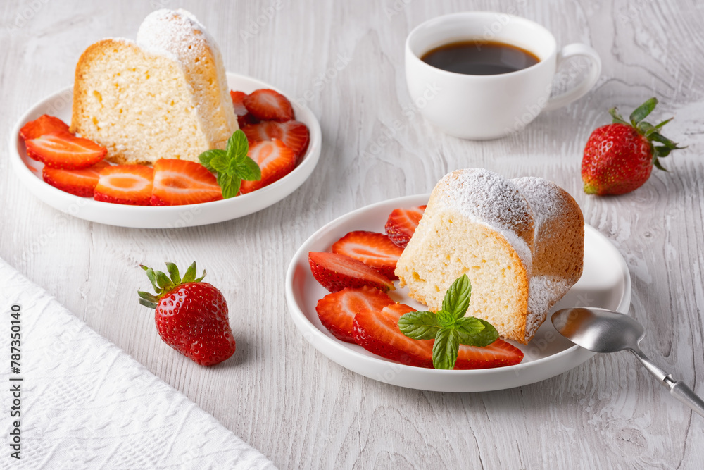 Piece of cupcake with strawberries on a plate Piece of cupcake with strawberries on a plate