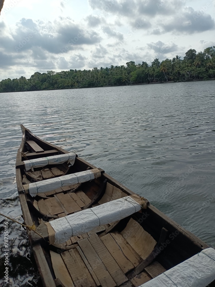 A canoe is a lightweight narrow water vessel, typically pointed at both ends and open on top, propelled by one or more seated or kneeling paddlers facing the direction of travel and using paddles.