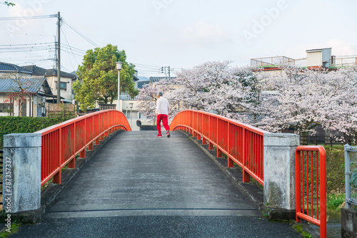 old Japanese man jogging at  Ureshino onsen park in morning © Blanscape