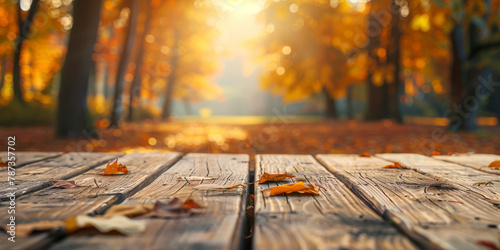 The empty wooden table top with blur background of autumn.