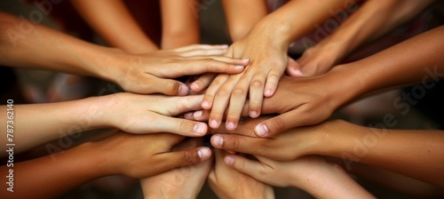 Diverse people joining hands teamwork, empathy, partnership, and social connection in business