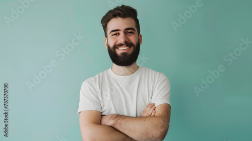 Waist up portrait of bearded young man smiling at camera while standing with arms crossed against pastel green minimal : Generative AI