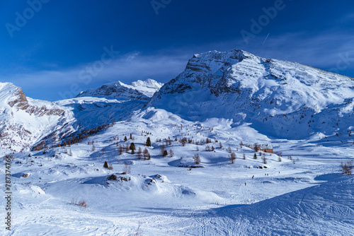 The Simplon Pass, snowy with the peaks of the Lepontine Alps and the small village of "Hopsce", near the town of Simplon, Switzerland