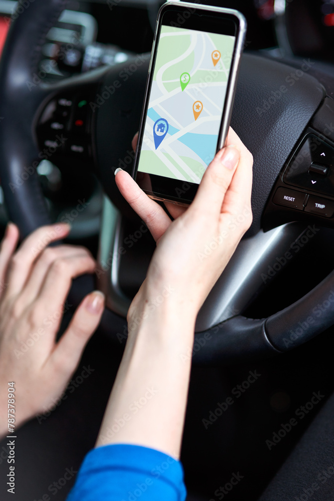 Driving phone screen and person with online navigation, travel and direction for destination. Transport, website and hand of driver with smartphone, mobile app and location pin for map on road trip Driving phone screen and person with online navigation, travel and direction for destination. Transport, website and hand of driver with smartphone, mobile app and location pin for map on road trip