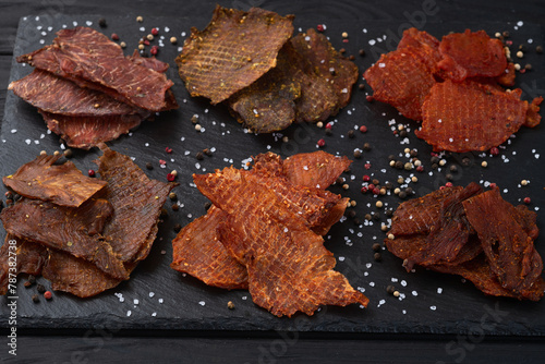 Mix of dried meat Jerky . From chicken , beef and pork.