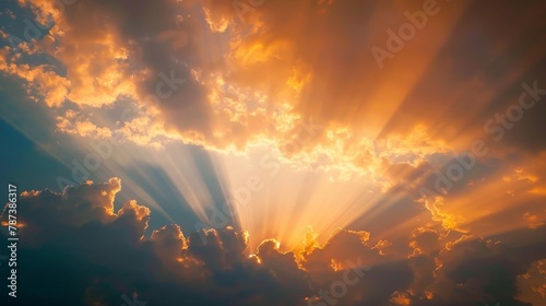 The sun is shining through the clouds, creating a beautiful and serene scene. The warm colors of the sun and clouds create a sense of peace and tranquility