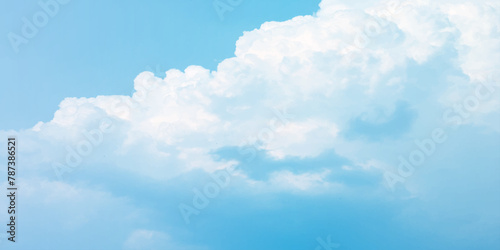 It's a hot day with the sun shining down on a blue sky filled with alternating small and huge clouds moving gently while the light from the sky creates a remarkable abstract shape. Horizon, Cloud Back