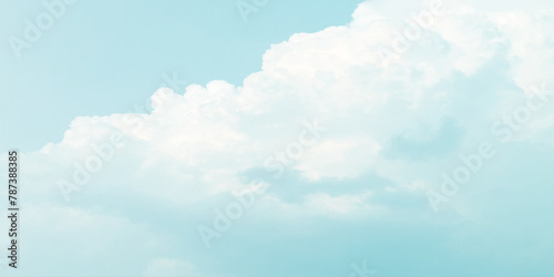 It's a hot day with the sun shining down on a blue sky filled with alternating small and huge clouds moving gently while the light from the sky creates a remarkable abstract shape. Horizon, Cloud Back