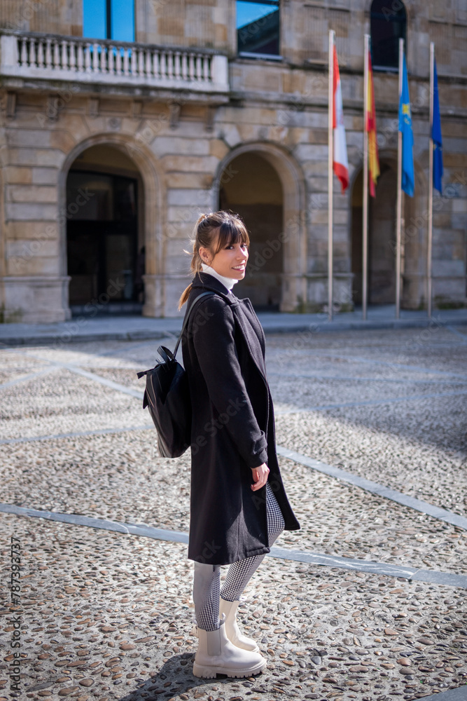 In Gijón's urban heart, a woman in white boots discovers its cultural legacy